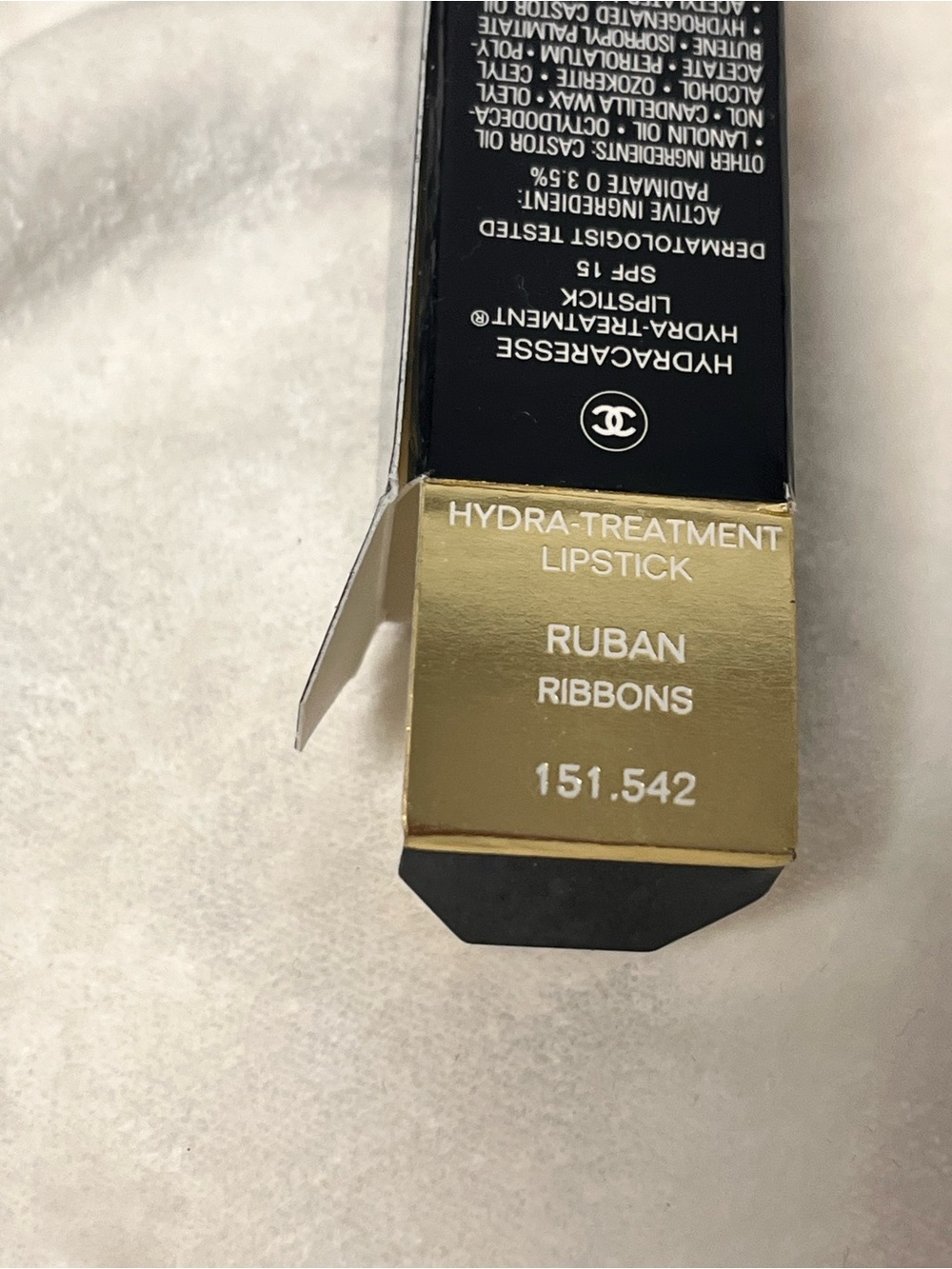 Lipstick box labeled Hydra-Treatment